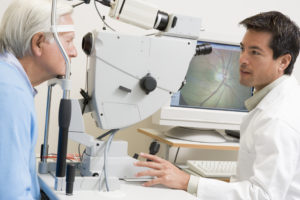 Doctor Checking Patient's Eyes Using Retinal Scanner